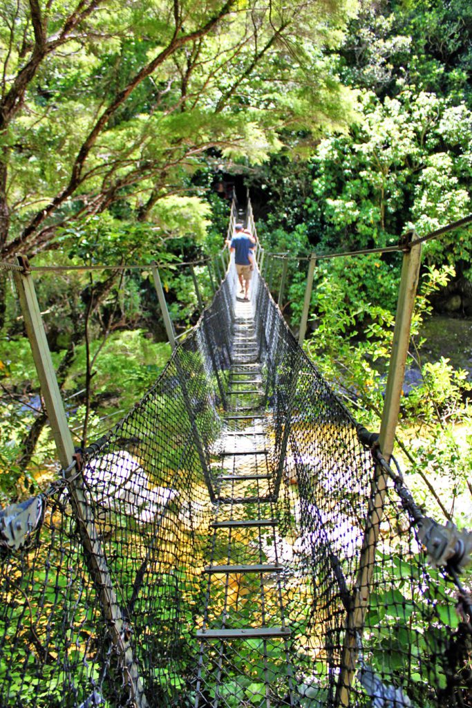 New Zealand's Wainui Falls Swing Bridge | 10 Must see locations at Golden Bay New Zealand #goldenbay #newzealand #wainuifalls #simplywander